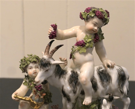German Porcelain Goat and Putti Figure - Mother and Baby Goat with2 Putti Figures -Ornate Metal Base -  8 Tall 8 Across - Marked 180 SV - Some Minor Broken Petal and Nicks