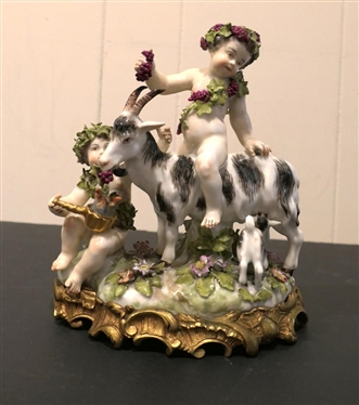 German Porcelain Goat and Putti Figure - Mother and Baby Goat with2 Putti Figures -Ornate Metal Base -  8 Tall 8 Across - Marked 180 SV - Some Minor Broken Petal and Nicks