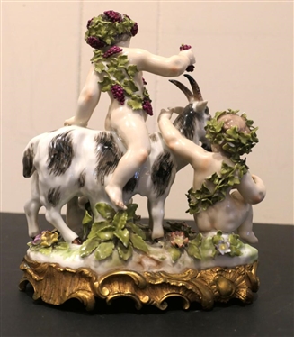 German Porcelain Goat and Putti Figure - Mother and Baby Goat with2 Putti Figures -Ornate Metal Base -  8 Tall 8 Across - Marked 180 SV - Some Minor Broken Petal and Nicks