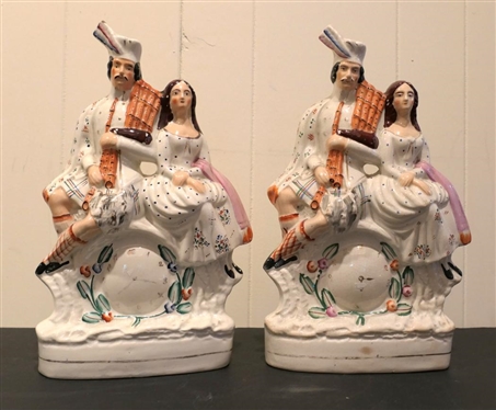 Pair of 19th Century Staffordshire Courting Figures with Clocks in Centers -Hand Painted - Some Minor Paint Flakes - Figures are Each 14 1/2" Tall 