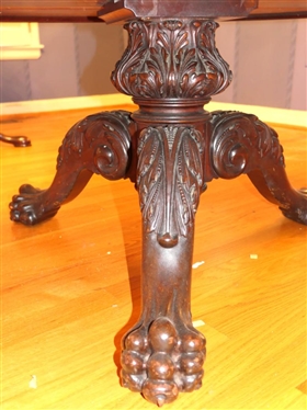 Ornate Round Mahogany Coffee Table with Heavily Carved Pedestal Base and Claw Feet - Carved Border Around Table Top with Protective Glass Top - Table is 18 1/2 Tall 38 Wide 