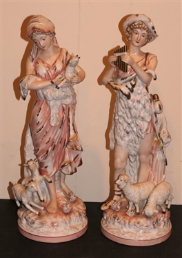Pair of Antique Porcelain Figures - Woman with Goats and Man with Sheep - Hand Painted - Each Figure is 16 tall - Goat Ear is Chipped Otherwise Both are in Good Overall Condition 