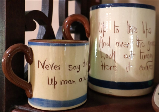 Collection of Larger Pieces of Devon Motto Ware English Pottery - Tea Pot, Large Mug, Smaller Cup, Egg Coddler, and  Cheese Dish- Tea Pot Has Thin Hairline - Large Mug is 4 1/2 Tall 