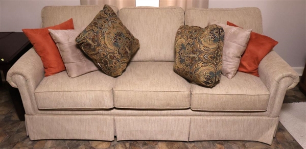 Clean Tan / Beige Sofa - 3 Cushion - Back Cushions Are Attached - With An Assortment of Coordinating Throw Pillows - Sofa is 83" Long 36" Deep 